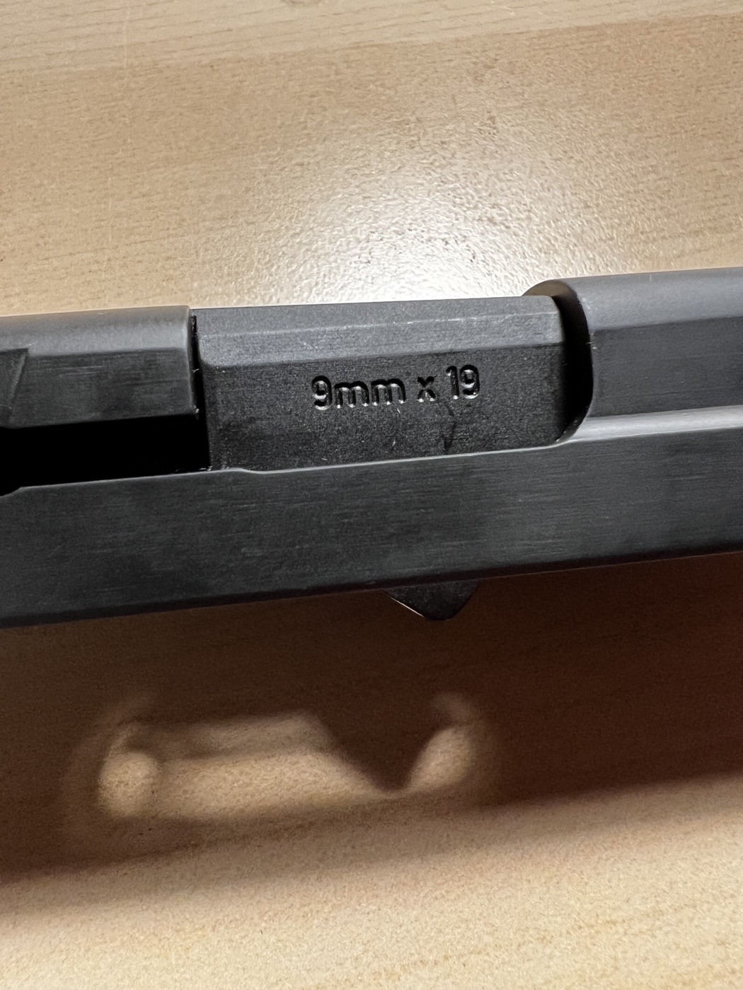 Closeup of Sig Sauer P226 barrel showing SIG SAUER engraving after cryogenic treatment